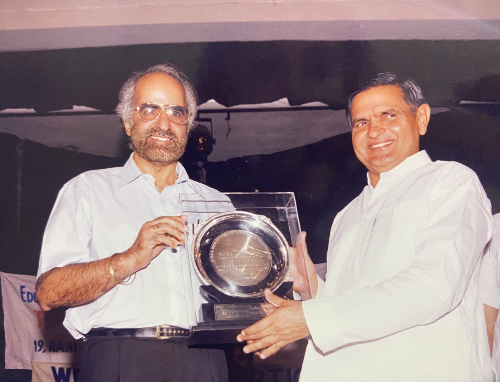 Prof. Dhillon receiving a FEPI award