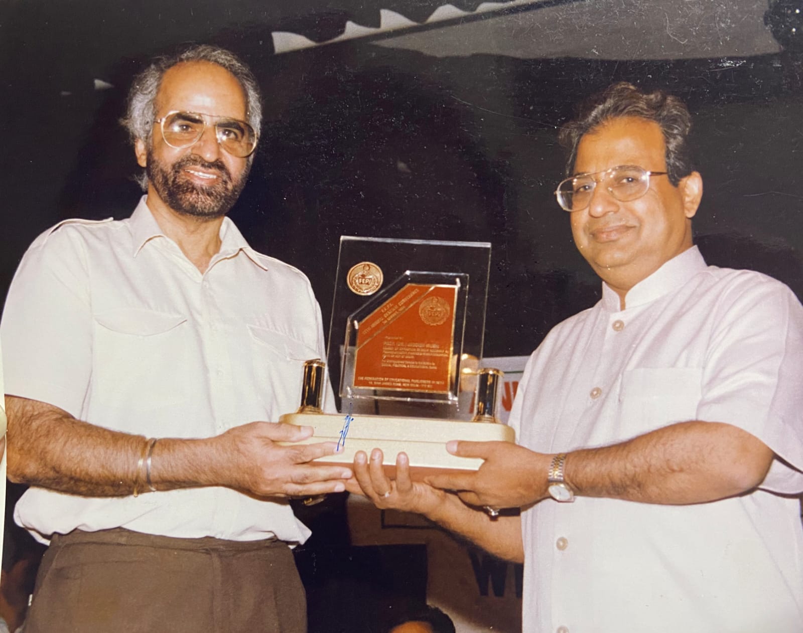 Prof. Dhillon receiving a FEPI award